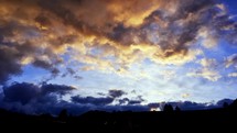 Clouds at sunset in pastel colours. Sky with clouds, weather, nature, blue clouds, sunlight, silhouette landscape
