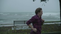 a man running outdoors in the rain 