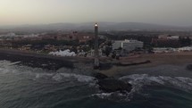 Maspalomas Lighthouse and resort on the coast, aerial