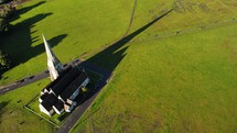 aerial view over a rural church 