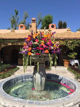flower arrangement over a fountain 