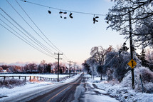 Country road with Shoes on a line after an ice storm in Winter