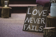 love never fails sign 