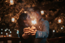 a couple holding sparklers 