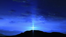 Bright cross on the hill with clouds moving on blue starry sky. Easter, resurrection, new life, redemption concept. Seamless looping background 