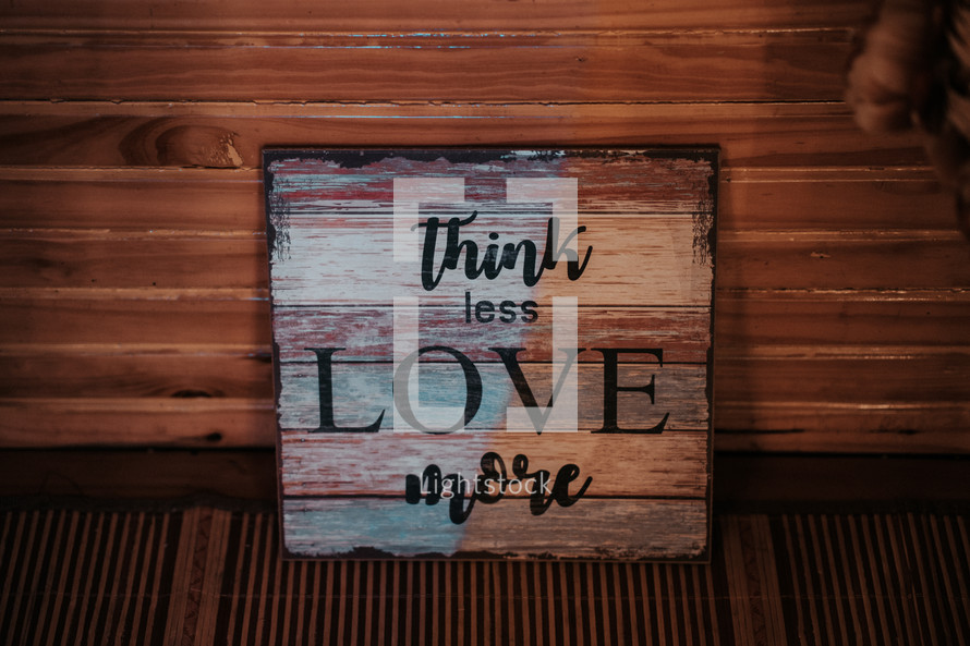Think less love more sign 