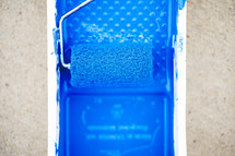 blue paint and paint roller 