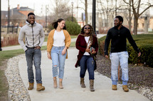 group of young adult walking together 