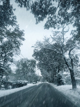 Driving on a Road with Winter Falling Snow