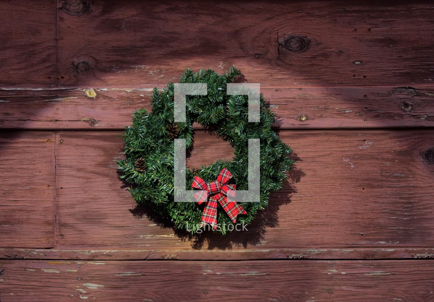 Christmas wreath against a brown background 
