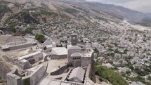 Aerial over iconic Gjirokastër fortress in UNESCO city Gjirokaster, Albania