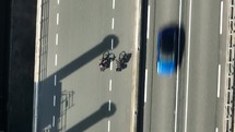 Two Cyclists Riding on a Road Bird's Eye View