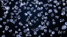 Many jewelry diamond stones falling on black background. Crystal stones and jewelry. Concept of wealth and prosperity. Seamless looping