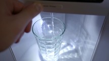 Fridge Water Dispenser Fills Glass