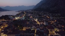 Twilight over Kotor, Montenegro with city lights and bay panorama