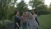 women talking outdoors 