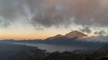 Landscape of Mount Batur Volcano and Lake in Kintamani, Bali, Indonesia - Morning Sunrise Time Lapse