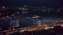 Aerial view at night of yachts and sailboats in the Port of Kotor in Montenegro