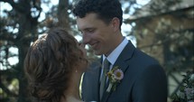 Happy couple, husband and wife, bride and groom kissing on wedding day.