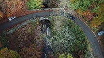 Aerial View of Car Driving Over Cloghleagh Bridge in Autumn, County Wicklow, Ireland