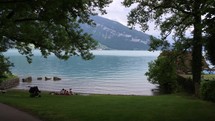 family picnic on a lake shore in Switzerland 