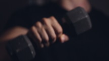 a man holding a dumbbell 
