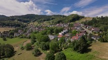 Aerial view of a quaint village nestled in the lush German countryside