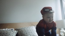 toddler boy in a spider man costume 
