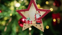 Star shaped christmas decoration hanging on a Tree 