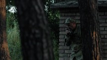 Hidden Military Soldier In The Forest Talk To Transceiver