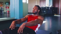 a man doing sit-ups in the gym