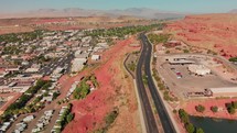 drone view of street with red rocks in st. george utah