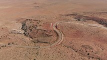 S shaped Highway through desert captured by drone