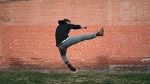 man doing a flying karate kick 
