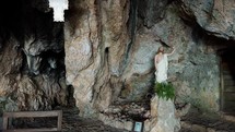 Jesus Christ statue inside an old cavern spot