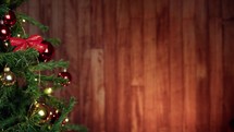 Snowy falling with Christmas tree and wooden background