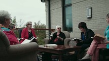 senior women having a Bible study 