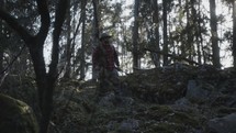 a man hiking through the forest 