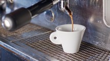 Espresso machine preparing a cup of espresso coffee.