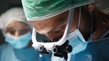Doctor With Surgical headlamp in operating room