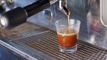 Espresso machine preparing a shot of espresso.