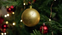 Christmas golden ball on the tree