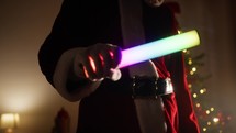 Santa claus holding a colorful Led tube 