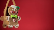 Gingerbread man decoration on red background