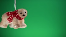Bear Christmas decoration on green copy space background