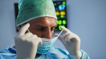Italian Dentist wears mask before surgery