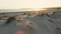 The calm ocean after the sand dune before sunset in Sicily