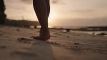 Man Running on Beach Sand Barefoot during Sunset Slow Motion