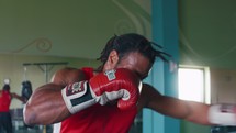 boxer punching a punching bag 