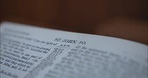 Closeup of bible in a church opened to the gospel of John.